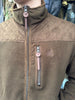 Brown quilted jacket with zipper details on a blurred background