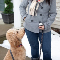 Zippo 6-Hour Handwarmer Pearl in woman's hand while she is walking dog in snow